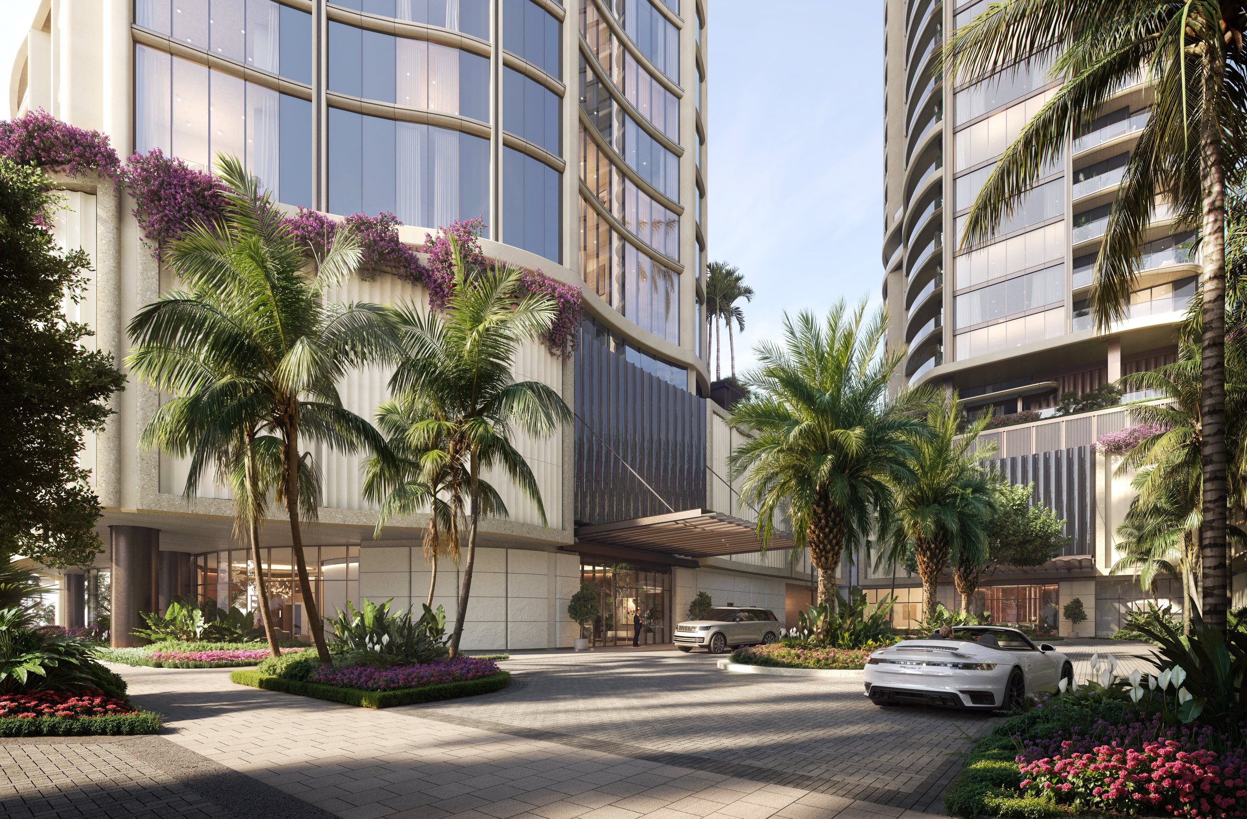 Landscaped arrival court and porte-cochere entrance at Edgeworth West Palm Beach luxury condominium