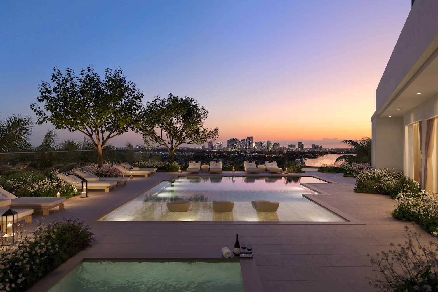 Rooftop pool terrace with lounge chairs and panoramic Intracoastal views at The Ritz-Carlton Residences Fort Lauderdale Beach